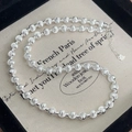 Detailopname van S925 sterling zilveren kralenketting met hartvormige hanger en sluiting - Zilver