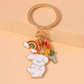 Close-up of golden keychain with white dog charm, rainbow cloud, and colorful HAPPY letters - Rainbow Letter