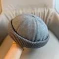 Close-up of a grey knitted docker hat with thick folded brim and soft texture - Adjustable / Grey Knit Edge Skull Cap