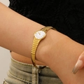 Detail of vintage gold-tone watch bangle showing the refined wrist fit and bracelet texture - 18K Gold Color White Round Bracelet Watch (12315)