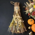 Detail of handcrafted twig broom with dried flowers, herbs and a silver pentagram pendant - Broom+Flowers+Pentagram