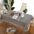 Detail of blue and white geometric table cloth with elegant white tassels on a wooden table - 60*60cm / Black Triangle with Beige Tassels