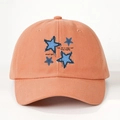 Detail of orange cotton baseball cap featuring blue stars and eternal light embroidery - One Size / Orange