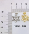 Macro shot of gold and silver snowflake pendants with zircons and size ruler details - Style D-Gold Large Snowflake Pendant