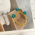 Vintage gold OT buckle bracelet with three teal Murano glass heart pendants - Bracelet / Blue