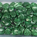Polished malachite heart stones in bulk with unique green and black natural banding - Unpolished Malachite