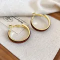French vintage gold metal hoop earrings with brown velvet wrap on wooden base - Gold Brown