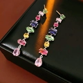 Detailed macro shot of long drop earrings with colorful zircons on a black jewelry box - Earrings - Multi-color (Silver Pin)