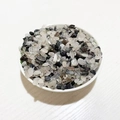 Polished natural crystal quartz gravel in small irregular shapes within a white bowl - Black Rutilated Quartz