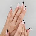 Pink French press-on nails with black tips and bow accents in a medium-long pointed shape - Pointed Shape / Pink Base Black Tip French (1XB1-13574)