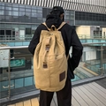 Khaki canvas backpack for travel with leather details and large capacity shown on back - Khaki Large
