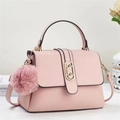 Pale pink lychee grain faux leather handbag with gold clasp and plush pom pom pendant - Pink