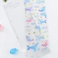 Holographic whale and dolphin stickers with gold foil stars for DIY journal decor - Whale