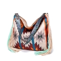 Close-up of bohemian woven tote bag with fringe details and embossed floral leather strap - Style 11