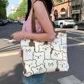 Cream canvas tote bag with brown bear print and shoulder strap in outdoor street setting - Cute Bear Full Print - Khaki