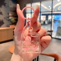 Pink flamingo liquid quicksand keychain in a square acrylic charm with pink glitter - Peach-Cube