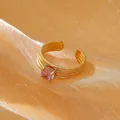Adjustable 18k gold plated ring with pink zircon and multi-layered textured band - One Size / Gold with Pink Zirconia
