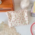 Floral cotton makeup bag with pink flowers on beige fabric in a cozy setting - Red