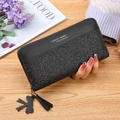 Black long zipper wallet for women featuring glitter patchwork and a tassel charm - Black
