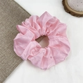 Elegant oversized pink satin silk scrunchie with soft ruffled texture and subtle gloss - Light Pink