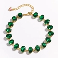 Detailed view of a gold chain bracelet featuring sixteen oval green zircon gemstones - Floral Vine Style (Model 4) / Gold