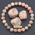 Natural Red Picasso Jasper beaded bracelet with polished raw stones on a dark background - Red Network Stone