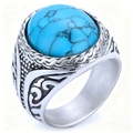 Vintage silver ring with oval turquoise stone and intricate floral engravings on white background - US 7 / Steel Color + Turquoise