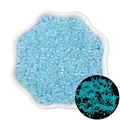 Luminous blue glass seed beads in petal bowl with inset showing glow-in-the-dark effect - Blue
