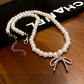 Elegant white pearl choker with a silver bow pendant and adjustable chain link - 43# Butterfly Pearl Necklace (Silver Pendant)