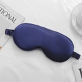 Luxurious deep blue silk satin sleep mask with elastic strap on a white fabric background - Navy Blue