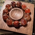 Handcrafted red bead bracelet with sparkling rhinestone spacers on a wooden tray - Black Walnut Bracelet Tray 10x10cm