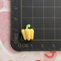 Detailed size view of a yellow mini pepper resin charm measuring 1.5cm on a scale mat - Yellow Bell Pepper