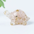 Pink crystal turtle figurine with gold foil flakes on a clean white background - 12 Rose Quartz + Gold Foil