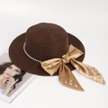 Detailed close-up of dark brown straw hat with pearl chain and champagne satin bow - One Size / Dark Coffee