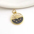 Detailed close-up of a round gold-plated pendant with black enamel stars and white crescent - Sun Star Collage