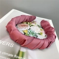 Detail of silk satin pleated headband in rose pink on a floral fashion magazine - Purplish Red