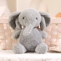 Soft plush elephant doll in light grey featuring a seated pose and fluffy texture - Elephant