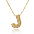 Detail view of letter J pendant necklace with gold plating and champagne zircon stones - Letter J