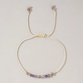 Handmade adjustable cord bracelet featuring faceted purple stones and gold beads - February-Amethyst