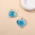 Macro shot of blue heart-shaped glass pendant with detailed internal floral patterns - Lake Blue (Type A)