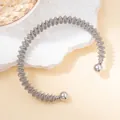 Macro detail of silver stainless steel coil bracelet with polished metal bead ends - Silver Densely Wrapped Ball Style (Silver#5)
