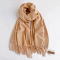 Detail view of the soft beige pashmina scarf texture with elegant fringe tassels - Beige