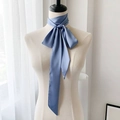 Detail of elegant dusty blue silk-like scarf tied in a bow with smooth satin texture - 190*5cm / Fresh Blue