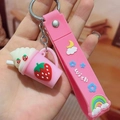 Pink strawberry milkshake keychain featuring a silicone wristlet with cute 3D ornaments - Strawberry Ice Cream / Pink