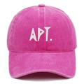 Detailed view of pink washed cotton baseball cap with white APT embroidery and twill texture - Rose Red