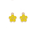 Detailed close-up of yellow enamel cherry blossom charms with golden metal edges - Yellow
