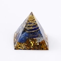 Orgone pyramid with blue crystals, copper coil, and gold leaf on white background - Lapis Lazuli