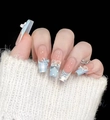Detailed view of light blue French press-on nails with 3D bows and lace patterns - 10 Pieces XS / Ice Blue Dream