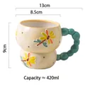 Bulbous 420ml ceramic mug with 3D yellow flowers and green beaded handle - Beaded Dragonfly Flower