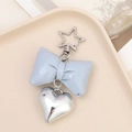 Detail of blue faux leather bow keychain with silver heart charm and star shaped clasp - Light Blue (K3616)